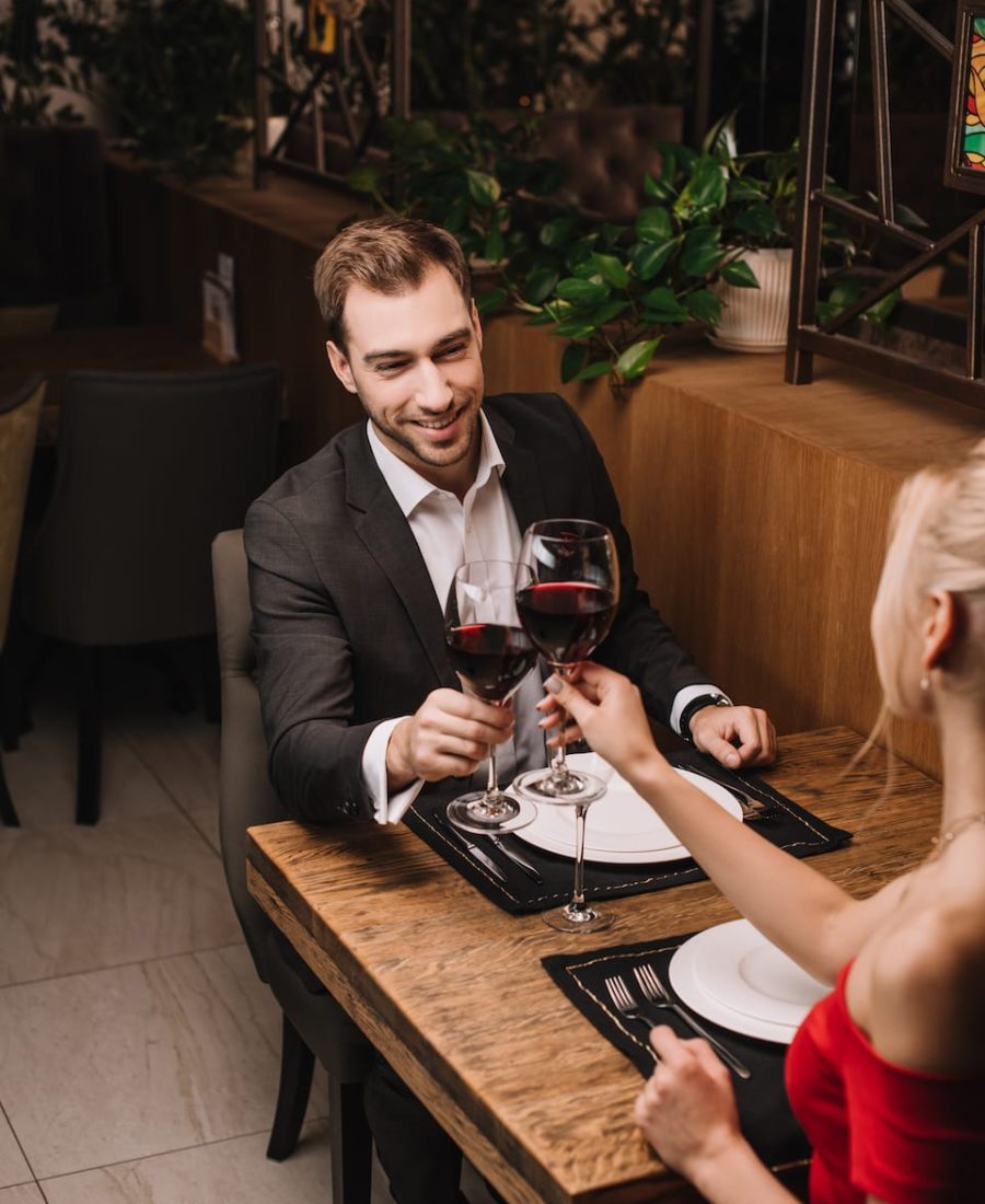 happy-man-toasting-with-wine-and-smiling-to-girlfr-2023-04-11-19-25-22-utc happy-man-toasting-with-wine-and-smiling-to-girlfr-2023-04-11-19-25-22-utc